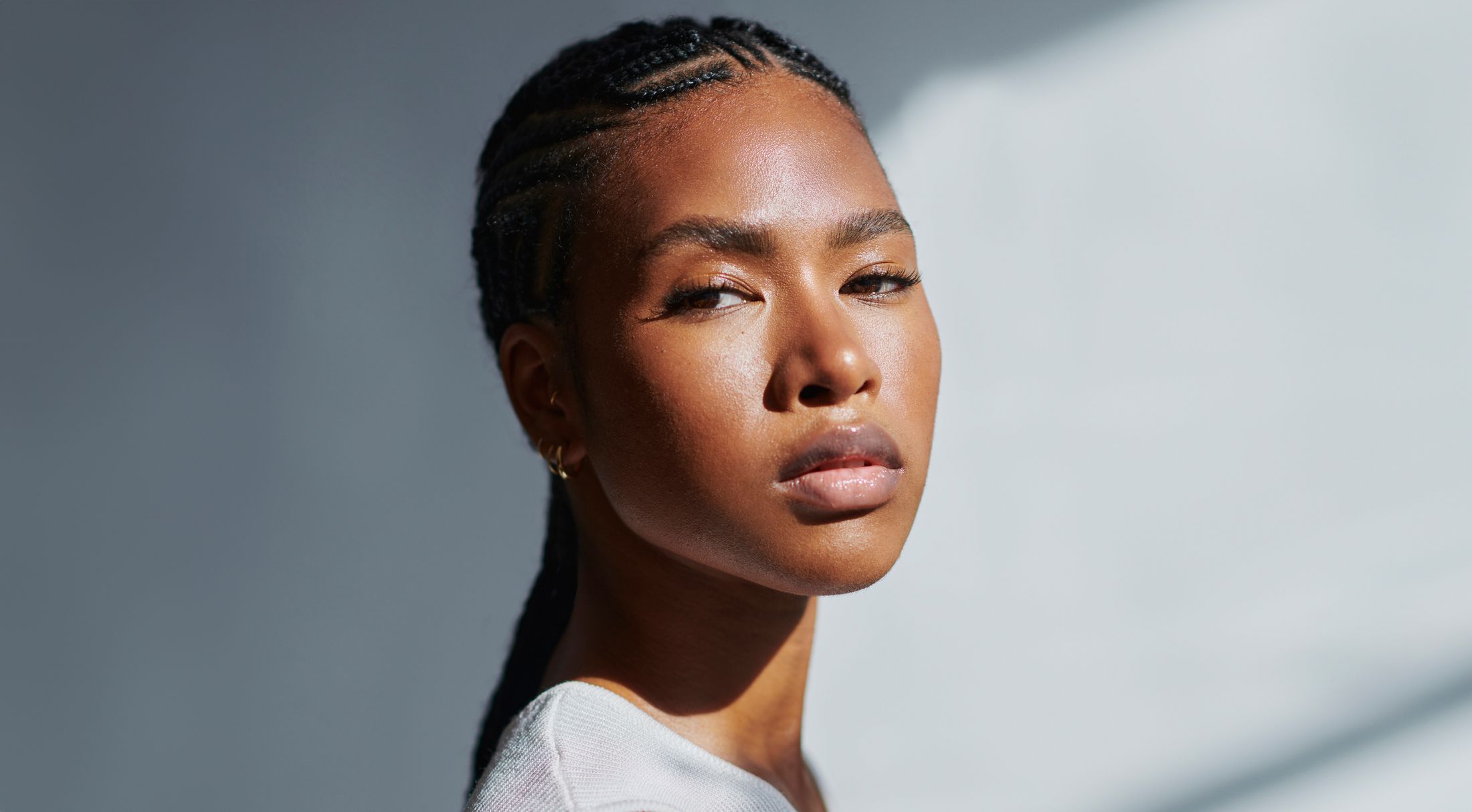 Portrait of a woman with braided hairstyle.