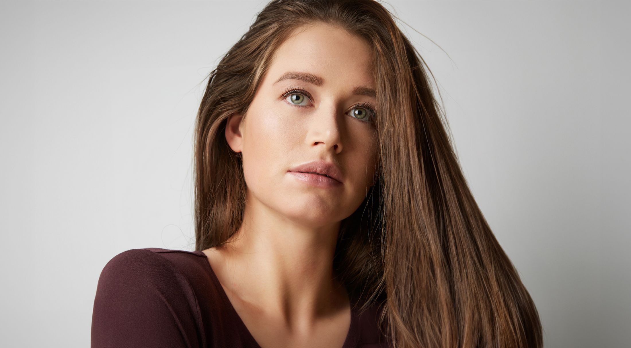 Portrait of a woman with long hair.